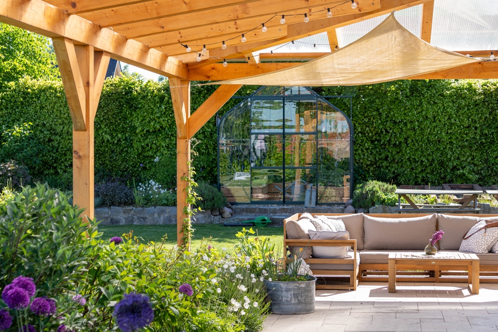 covered,terrace,with,furniture,in,the,garden,,glasshouse,in,the